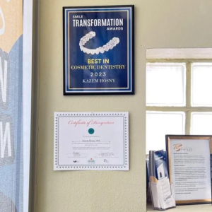 "Best in cosmetic dentistry 2023" Award hanging on wall in dentist office in Ontario